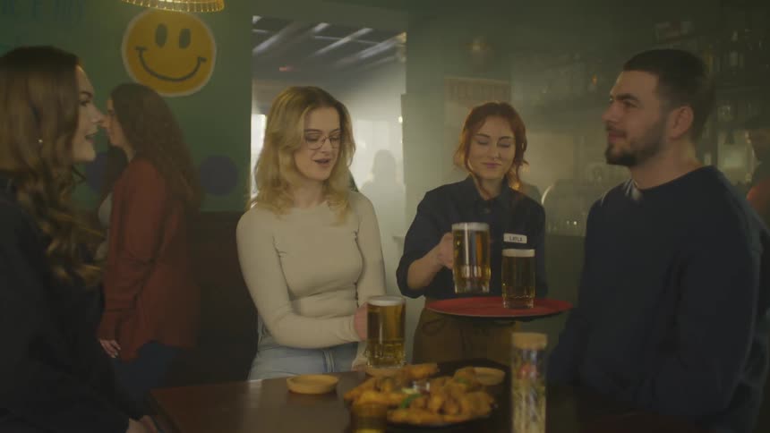A footage of friends having a drink at the pub