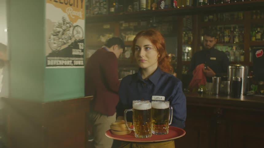 A clip of a waiter serving drinks