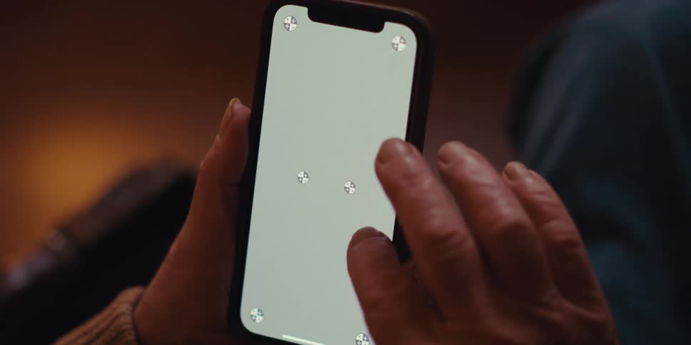 A footage of a person pressing a phone screen