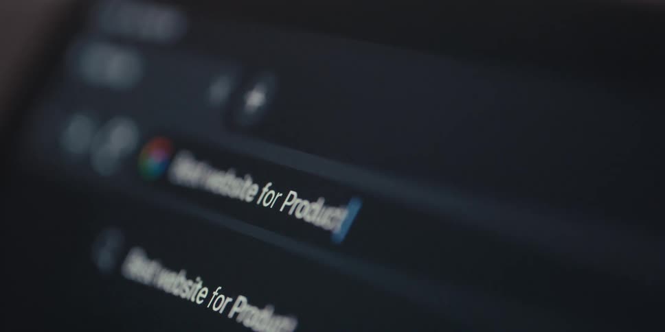 A user types best website for product reviews into a laptops search bar with the focus tracking the entered text and leaving surrounding letters blurred