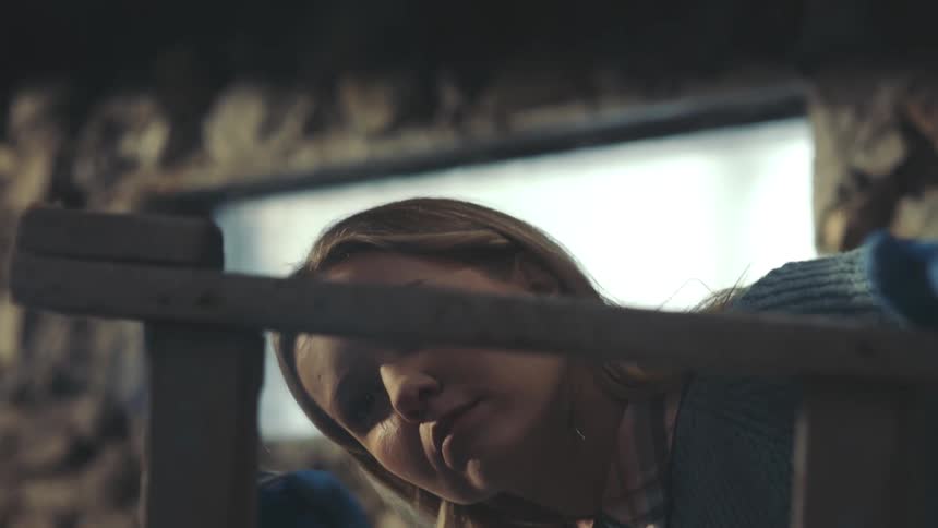 Blonde woman spray painting a staircase
