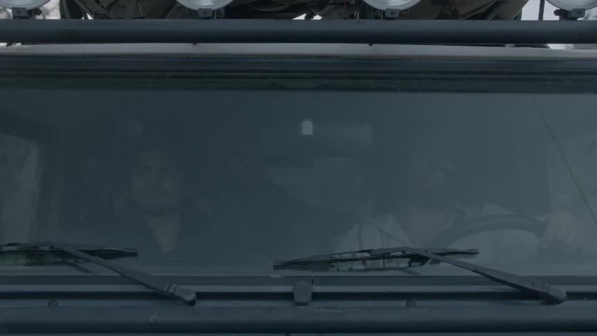 People ride in a vehicle