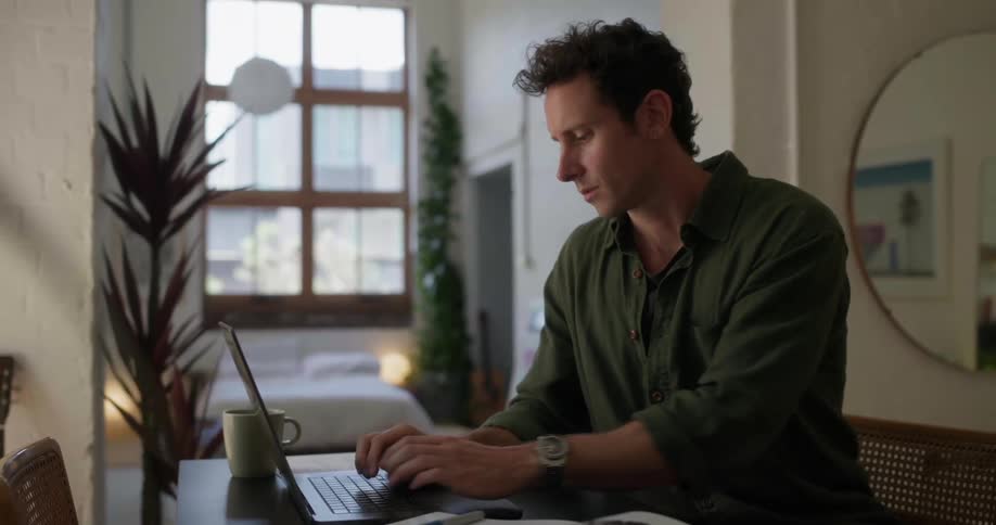 A footage of a person operating a computer indoor
