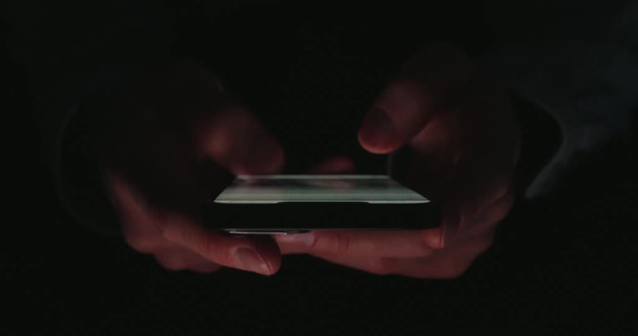 Pair of hands scrolling on a smartphone