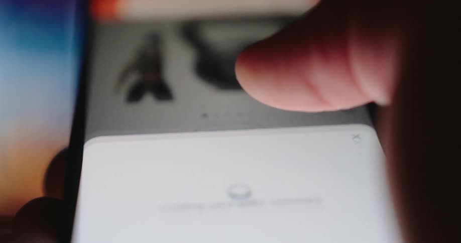 A footage of a person operating a smartphone