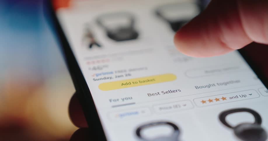 Person buys from a commercial website using a smartphone