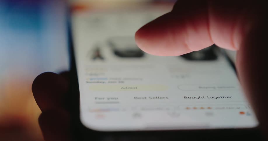 A person presses a button on his cell phone