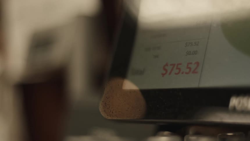 A closeup of a pointofsale terminal screen displaying a total amount of 7089