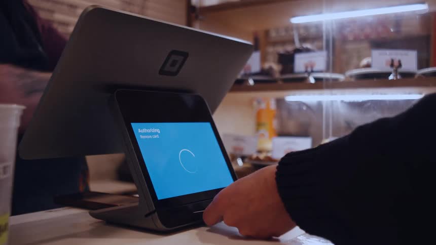 Person makes a payment at a selfservice terminal