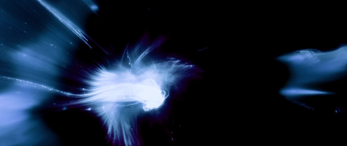White mass expands and flows creating a thin layer against a black background