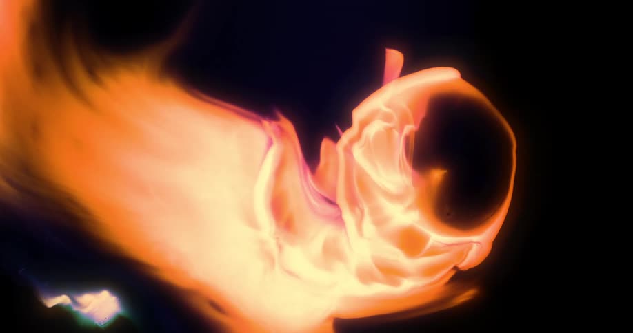 Bright orange portion of a mixture flows and expands