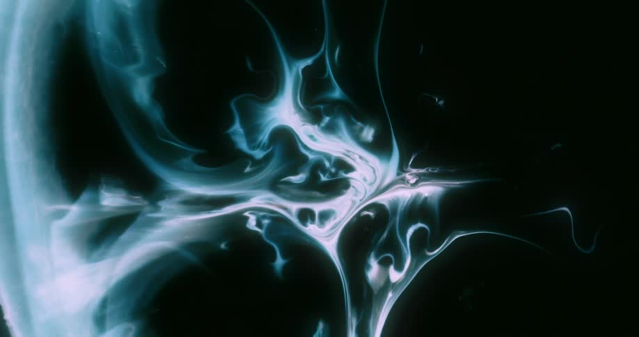 An abstract glowing weblike structure with fluid interconnected tendrils and nodes expands against a dark background