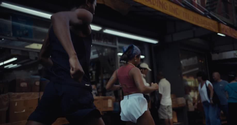 Man and woman running through the city