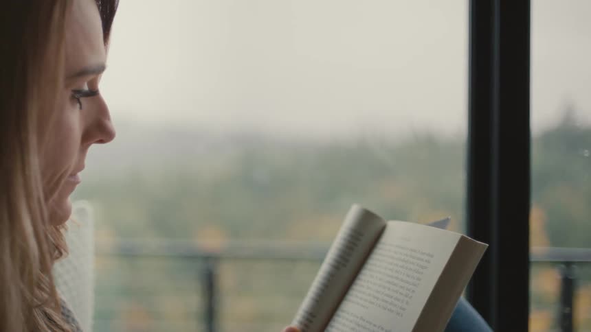 Woman sitting reading a book