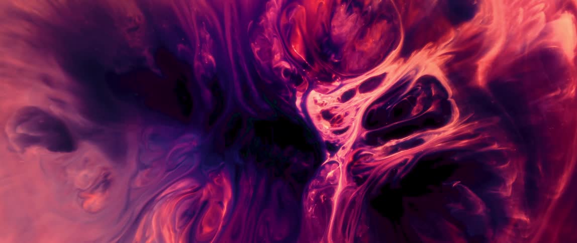 Abstract pattern in predominant colors of purple and red with fluid and undulating shapes