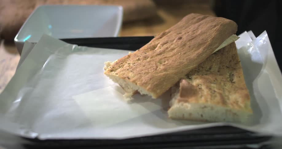 A footage of a person arranging breads