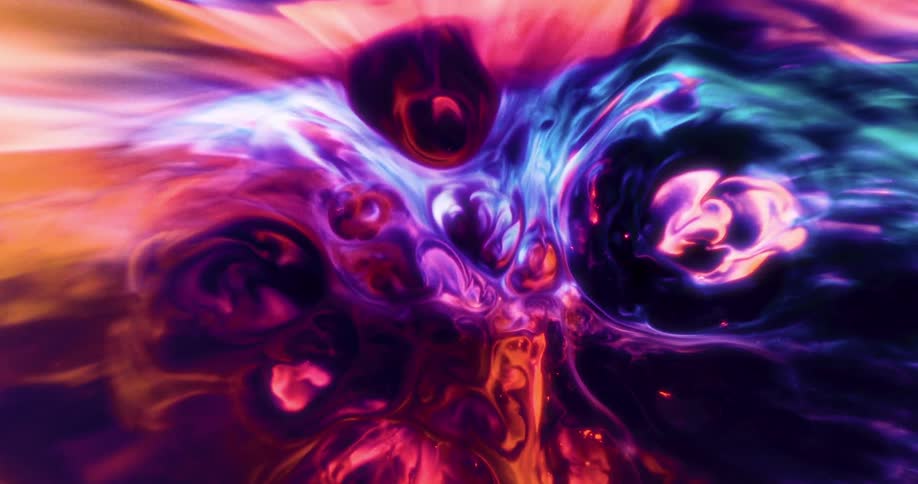 Abstract composition of colored liquids creates fluid patterns in vibrant shades of purple blue orange and pink