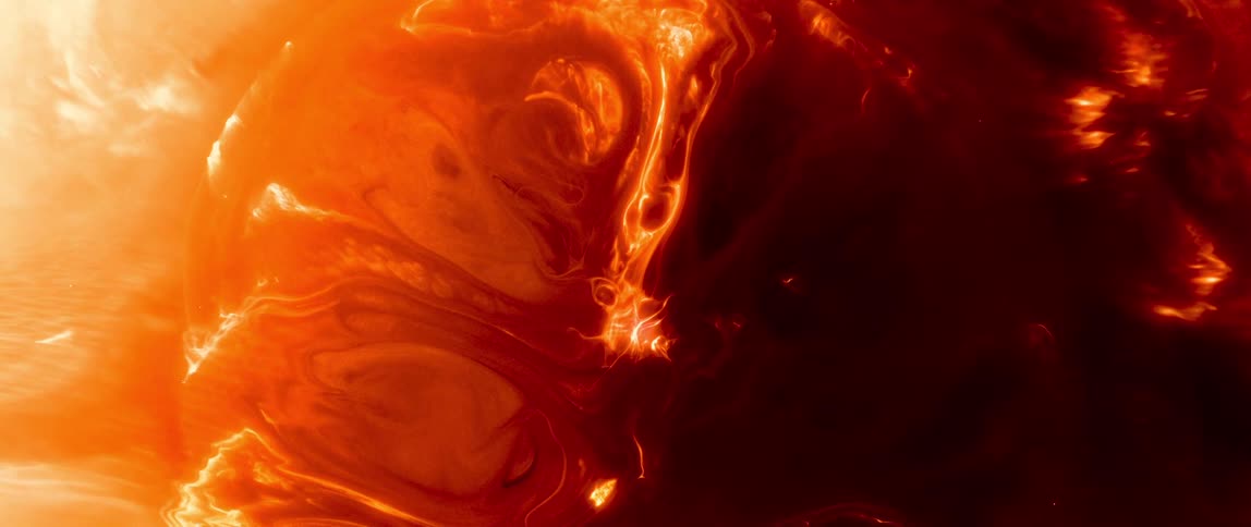Extreme close up of a reddish liquid bubbling and expanding abstractly