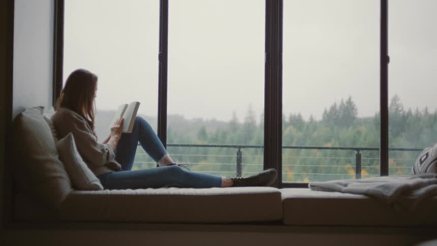 A footage of a lady reading indoor