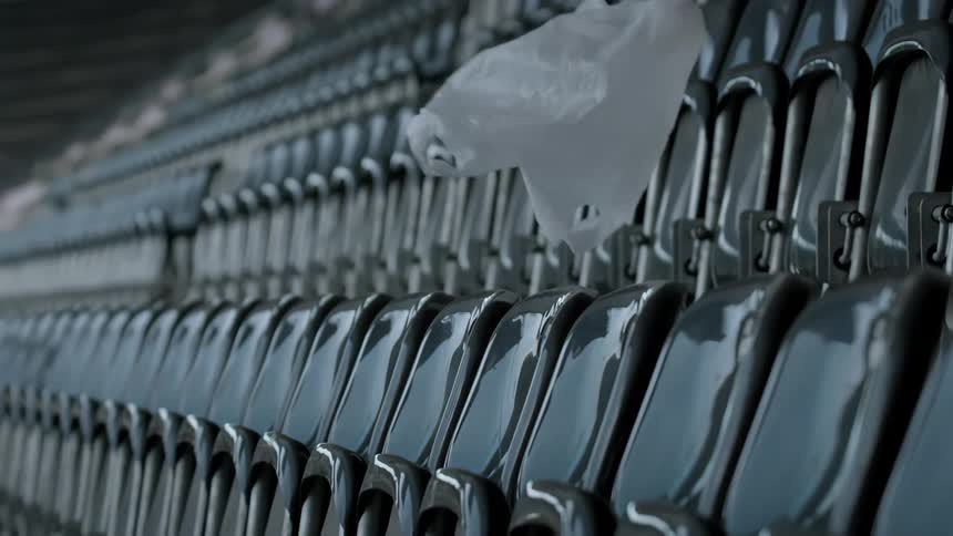 Plastic bag flying through empty stadium stands