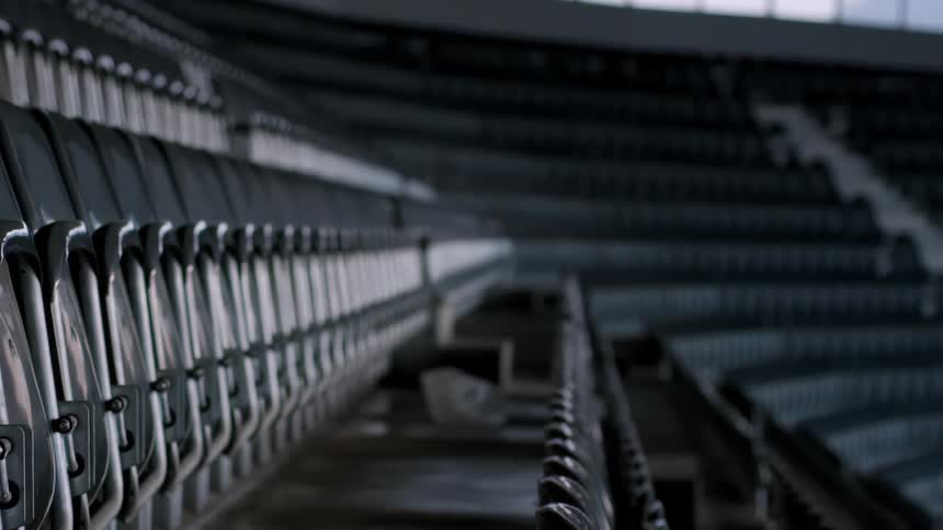 Plastic bag flying through the stands of an empty stadium
