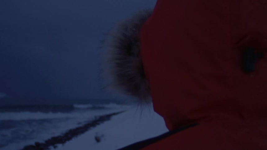 A flip of a person wearing a red hoodie