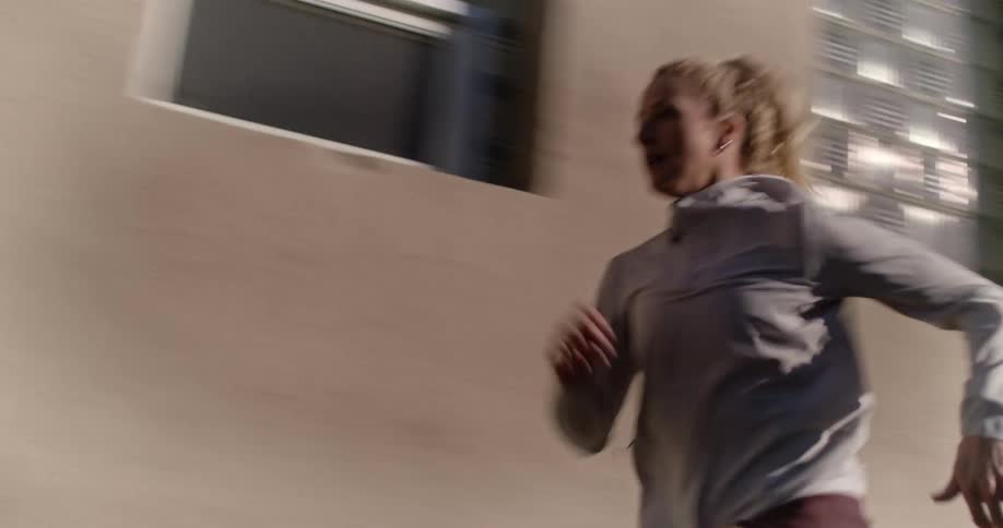 Blonde woman running at high speed