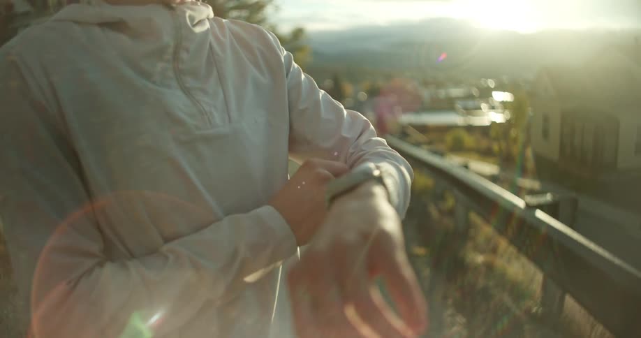 Woman looking at the watch on her wrist