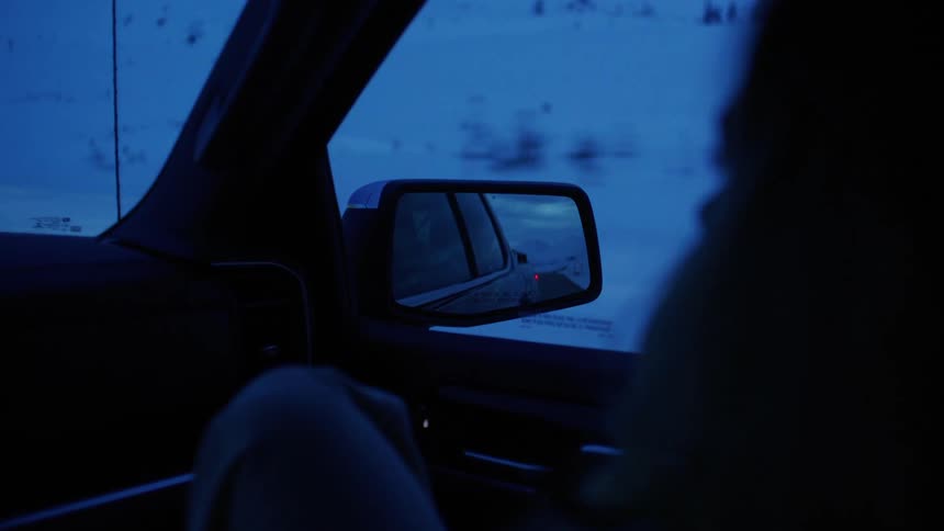 A footage of a person in a car
