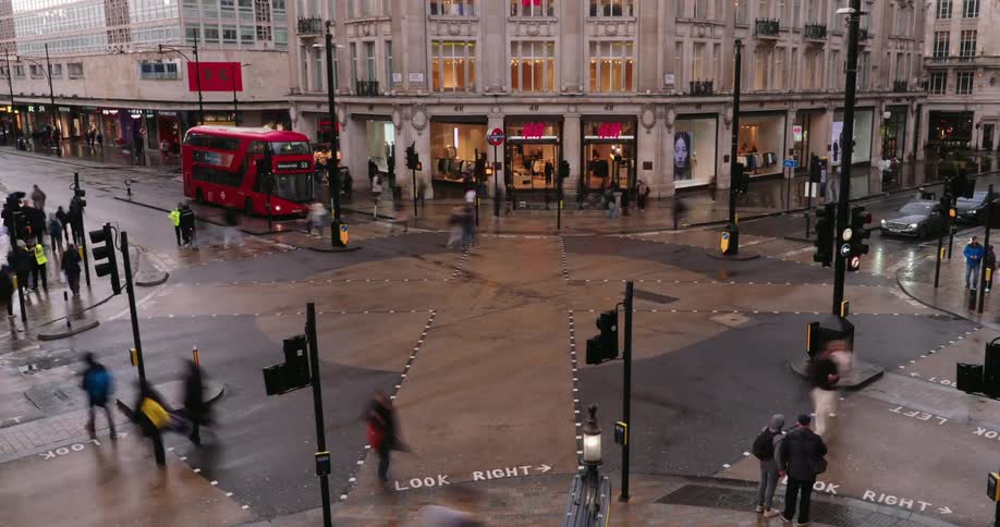 Time lapse view of cars and pedestrians are moving through the city