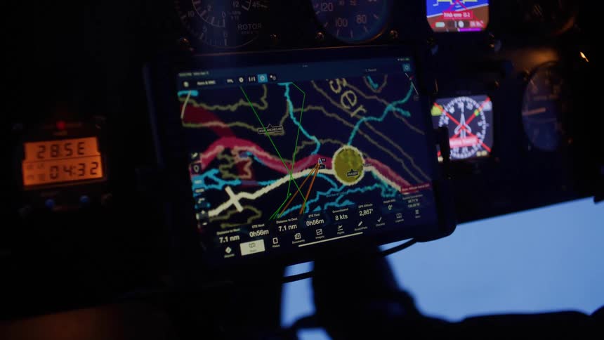 Control panel of an aircraft with a digital navigation screen displaying a detailed map