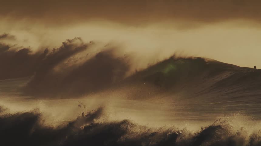 Surfers on waves in the sea
