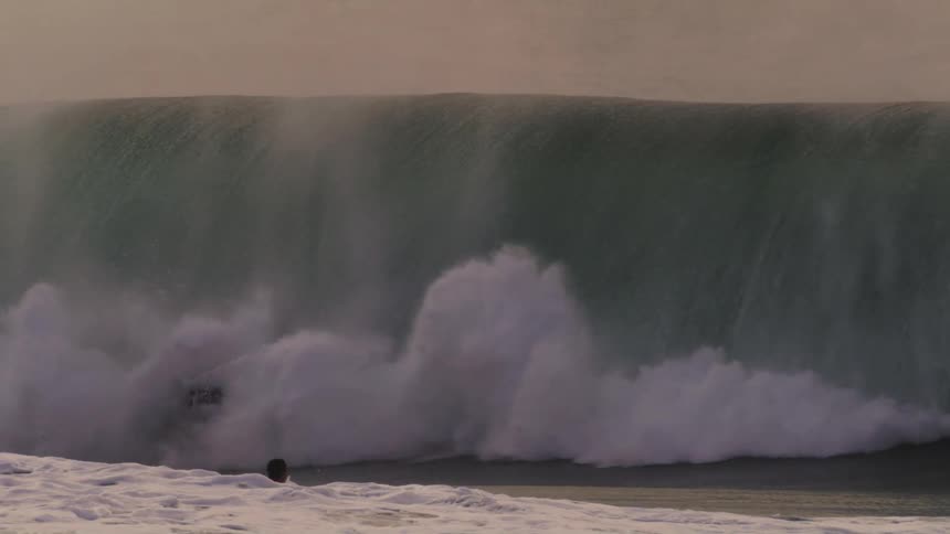 A clip of people surfing the sea waves