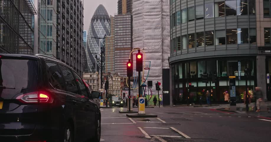 Busy street in london with pedestrians crossing