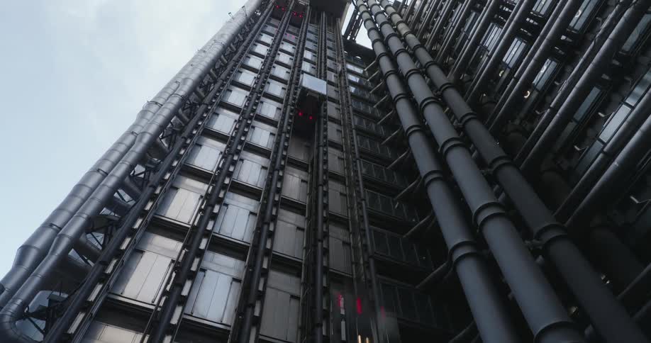 View upwards of a metal platform with elevators going up and down