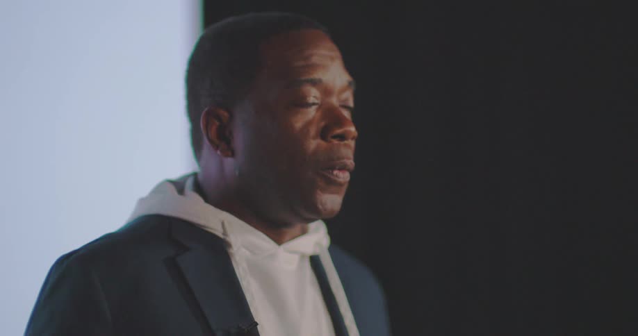 A footage of a black man speaking