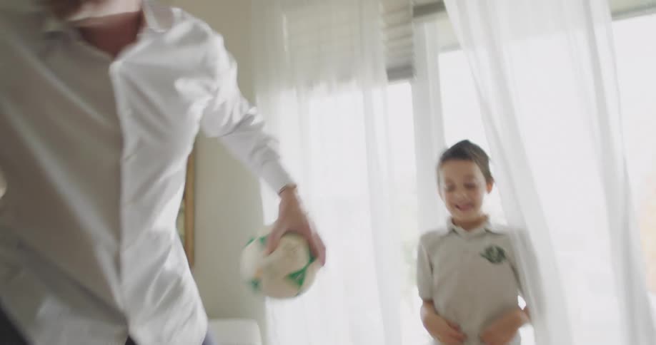 A father is playing with his children at home