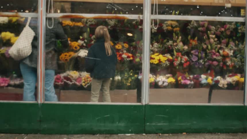 Mother and daughter in a flower shop
