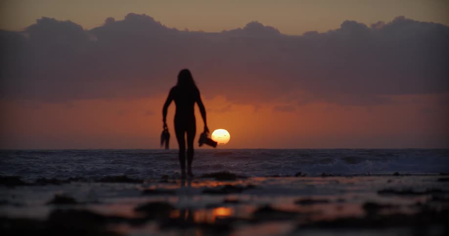 A footage of a person running towards the sea