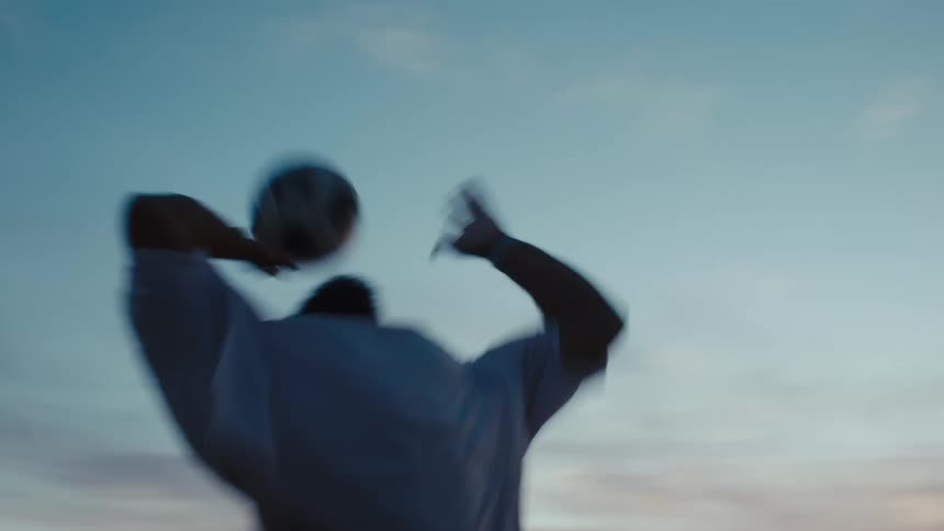 A footage of a person heading a ball