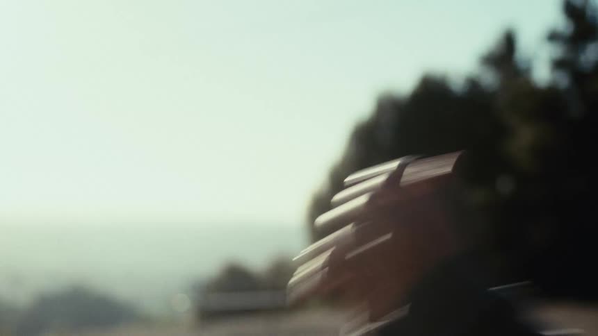 Closeup of a man performing situps outdoors on a sunny day