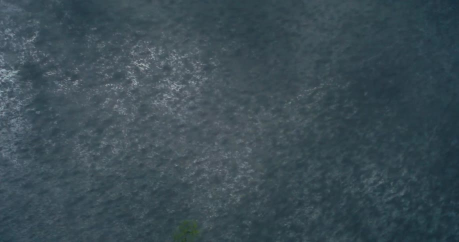 Several water particles falling together and quickly