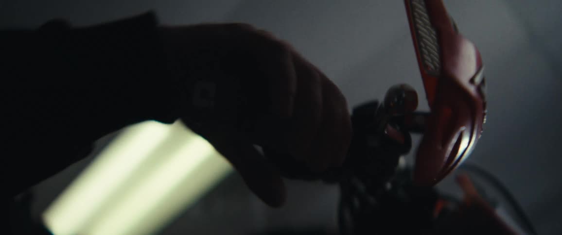 Hand holds and accelerates the handlebars of a motorcycle