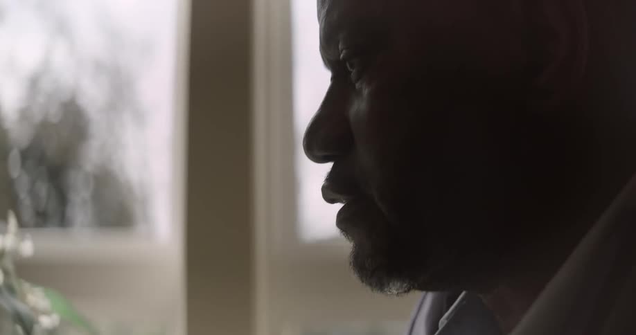 Man talking in front of a cell phone