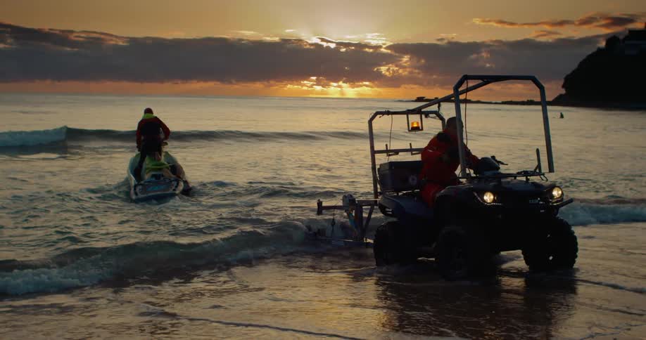 A man rides his jet ski from the shore
