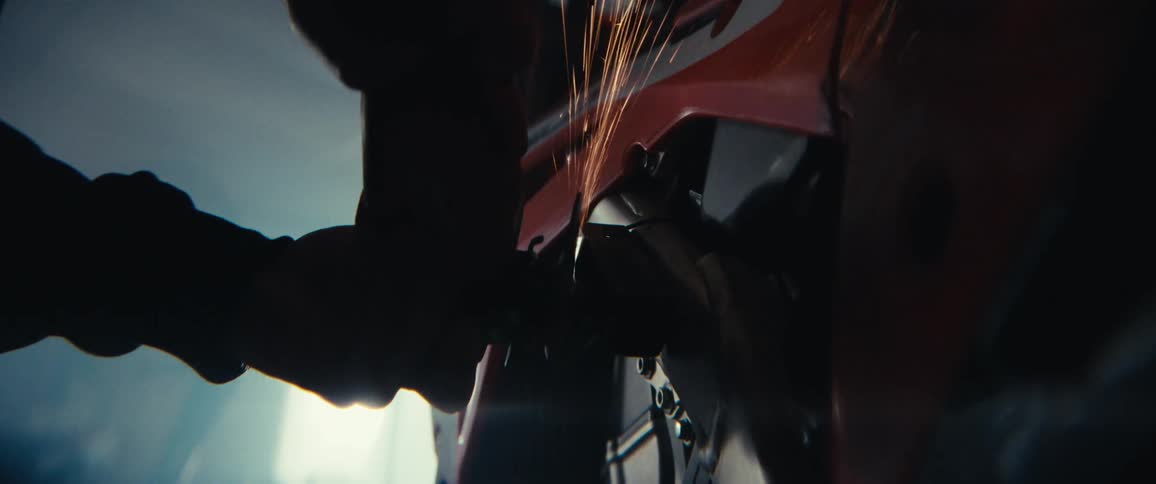 Pair of hands polishing the metal side of a vehicle