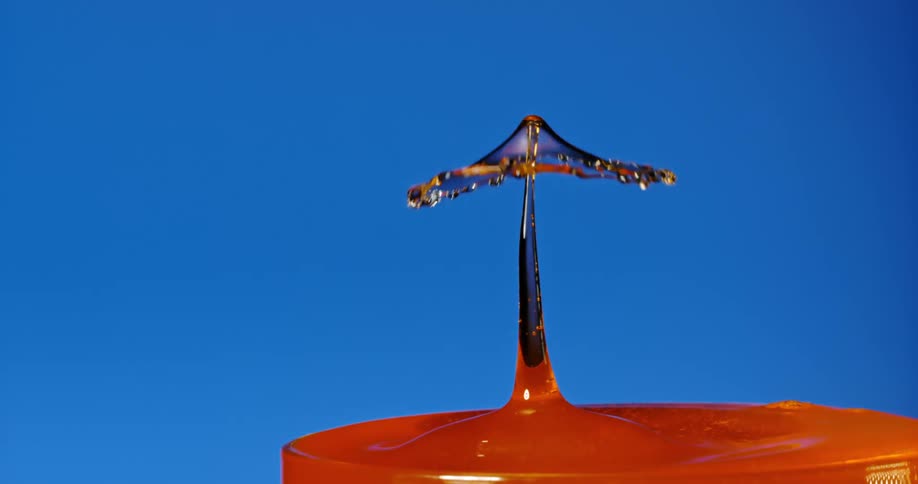 Liquid drips into the glass slowly