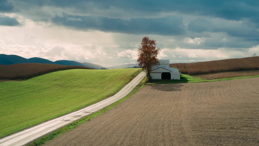 A path runs through the farm on the hill