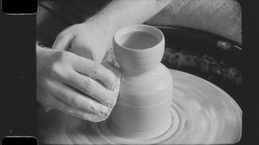 Hand sculpting a handmade clay vase