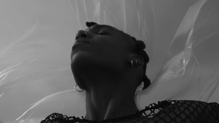 Portrait of a person with a transparent plastic in the background